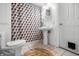 Cozy bathroom with pedestal sink, geometric shower curtain, and classic fixtures at 4013 Hillendale Dr, Greenwood, IN 46142
