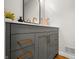 Stylish bathroom vanity features a gray cabinet, gold hardware, and a modern black-framed mirror at 4013 Hillendale Dr, Greenwood, IN 46142