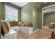 Sunlit bedroom showcasing built-in window seating with plush pillows and a mirrored closet at 4013 Hillendale Dr, Greenwood, IN 46142