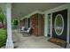 Covered porch with rocking chairs offering a relaxing outdoor space at 4013 Hillendale Dr, Greenwood, IN 46142