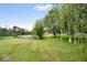 Picturesque backyard with a serene pond, mature trees, and plenty of space for relaxation and outdoor activities at 4016 Dogwood Ln, Franklin, IN 46131