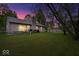 Backyard at dusk featuring a hot tub, outdoor grill, and serene ambiance, ideal for evening relaxation at 4016 Dogwood Ln, Franklin, IN 46131