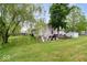 Beautiful backyard featuring a well-maintained lawn, storage shed, and space for outdoor seating and gardening at 4016 Dogwood Ln, Franklin, IN 46131