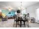 Cozy dining area adjacent to living room and kitchen, featuring modern lighting at 4016 Dogwood Ln, Franklin, IN 46131