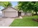 Charming single-story home with a brick facade, attached garage, and a well-maintained front yard at 4016 Dogwood Ln, Franklin, IN 46131