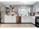 This charming kitchen features ample storage, stainless steel appliances, and a bright window above the sink at 4016 Dogwood Ln, Franklin, IN 46131