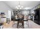 Well-equipped kitchen with stainless steel appliances, gray cabinetry, and a functional dining area at 4016 Dogwood Ln, Franklin, IN 46131
