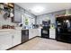 Well-lit kitchen with modern appliances, plenty of cabinet space, and light wood-look floors at 4016 Dogwood Ln, Franklin, IN 46131