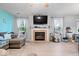 Bright living room with a fireplace, large windows, and open layout for easy entertaining at 4016 Dogwood Ln, Franklin, IN 46131
