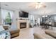 Open-concept living space with fireplace, dining area, and seamless flow to the kitchen at 4016 Dogwood Ln, Franklin, IN 46131