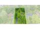 Aerial view of a property surrounded by lush greenery and mature trees at 426 Tipton Ln, Columbus, IN 47201