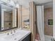 Bathroom featuring modern fixtures, tile accents, and built-in shelving at 426 Tipton Ln, Columbus, IN 47201