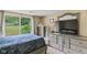 Comfortable bedroom featuring a sliding glass door with outside view and stylish bedroom furniture at 426 Tipton Ln, Columbus, IN 47201