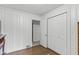 Bedroom with light-colored walls, wood floors, closet, and an entrance to an adjoining room at 426 Tipton Ln, Columbus, IN 47201