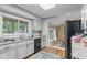 Bright kitchen featuring granite counters, stainless appliances, and hardwood floors at 426 Tipton Ln, Columbus, IN 47201