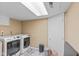 Functional laundry room equipped with modern washer and dryer units at 426 Tipton Ln, Columbus, IN 47201