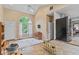 Open-concept living room with vaulted ceiling, large window, and seamless flow into the kitchen at 426 Tipton Ln, Columbus, IN 47201