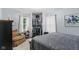 Spacious primary bedroom features an attached closet, comfortable seating, and ample natural light at 426 Tipton Ln, Columbus, IN 47201