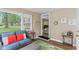 Cozy sunroom with a large window, comfortable seating, and stylish decor at 426 Tipton Ln, Columbus, IN 47201
