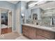 Bright bathroom with double vanity, sleek fixtures, and a separate dressing area visible at 435 Virginia Ave # 108, Indianapolis, IN 46203