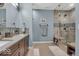 Modern bathroom featuring a double vanity, glass shower, and elegant tile work at 435 Virginia Ave # 108, Indianapolis, IN 46203