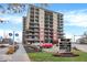 A high-rise building with multiple balconies, businesses, and easy access to area attractions at 435 Virginia Ave # 108, Indianapolis, IN 46203