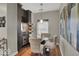 Cozy dining area featuring custom built-ins including wine fridge and glass table with seating for four at 435 Virginia Ave # 108, Indianapolis, IN 46203