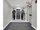 Well-lit hallway with neutral colors, potted plants, and exit sign at 435 Virginia Ave # 108, Indianapolis, IN 46203