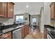Updated kitchen with granite counters, stainless appliances and view into dining area at 435 Virginia Ave # 108, Indianapolis, IN 46203