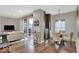 Living Room with kitchen, dining area and sliding glass doors to a balcony at 435 Virginia Ave # 108, Indianapolis, IN 46203