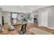 Bright and open condo living area with wood floors, bar seating, and modern decor at 435 Virginia Ave # 108, Indianapolis, IN 46203