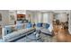 Comfortable condo living area with sofas, glass table, and hardwood floors at 435 Virginia Ave # 108, Indianapolis, IN 46203