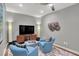 Comfortable living room features ceiling fan, accent lighting, and media center at 435 Virginia Ave # 108, Indianapolis, IN 46203