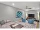 Spacious living room with ceiling fan, stylish rug, and comfortable seating at 435 Virginia Ave # 108, Indianapolis, IN 46203