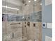 Beautiful walk-in shower with multiple shower heads and designer tilework at 435 Virginia Ave # 108, Indianapolis, IN 46203