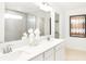 Bright bathroom featuring double sinks, large mirrors, and a glass-enclosed shower at 4397 Persian St, Greenwood, IN 46143