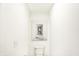 Minimalist bathroom with modern fixtures and a unique art piece at 4397 Persian St, Greenwood, IN 46143
