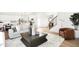 Open-concept floor plan featuring a living room, kitchen, and staircase with modern decor at 4397 Persian St, Greenwood, IN 46143