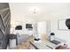 Well-lit home office showcasing a stylish accent wall, desk, chaise lounge, and modern decor at 4397 Persian St, Greenwood, IN 46143