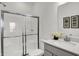 Modern bathroom with glass-enclosed shower, sleek vanity, and contemporary finishes at 4437 Persian St, Greenwood, IN 46143