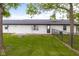 The backyard features a level lawn and partial fence around perimeter at 4605 S 150 W, Columbus, IN 47201