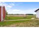 Large backyard features a swing set and views of the farmland at 4605 S 150 W, Columbus, IN 47201