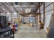 Spacious barn interior with basketball hoop and storage at 4605 S 150 W, Columbus, IN 47201