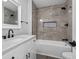 Charming bathroom features tiled walls, stylish fixtures, and a sleek vanity at 4605 S 150 W, Columbus, IN 47201