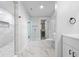 This bright bathroom features a tiled floor, modern fixtures, and a glass shower at 4605 S 150 W, Columbus, IN 47201