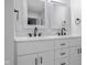 Bathroom offers a double sink vanity with white cabinets, and marble countertops at 4605 S 150 W, Columbus, IN 47201