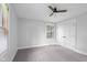 Comfortable bedroom with natural light, carpeted floor, closet, and a ceiling fan for relaxing at 4605 S 150 W, Columbus, IN 47201