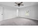 The bedroom offers plush carpet, ample natural light, and a ceiling fan for added comfort at 4605 S 150 W, Columbus, IN 47201