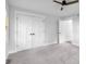 Cozy bedroom with neutral colors, carpeted floor, closet, and ceiling fan for comfort at 4605 S 150 W, Columbus, IN 47201