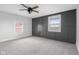 This bedroom features neutral walls and carpet, plus stylish board and batten accent wall at 4605 S 150 W, Columbus, IN 47201